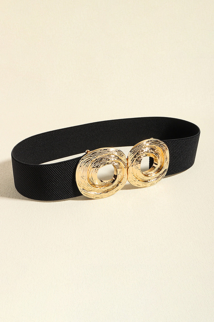 Black elastic belt with a textured gold double circle buckle
