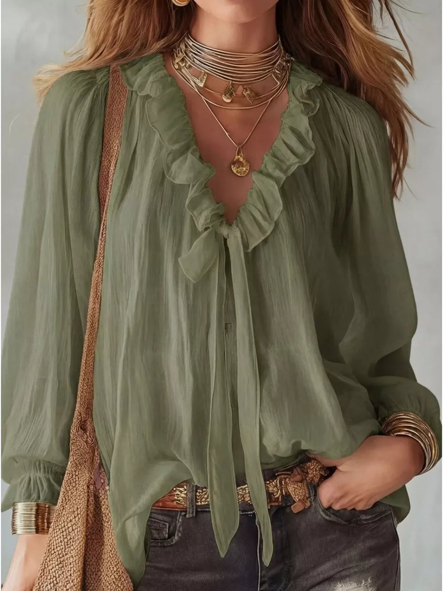 Khaki frilled tie-front shirt with ruffled neckline and long sleeves.