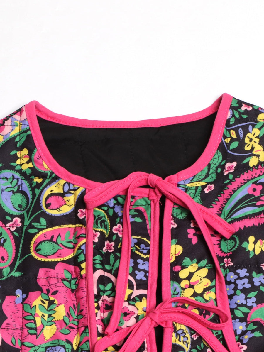 Paisley quilted jacket with tie closure in black with pink trim and floral print.
