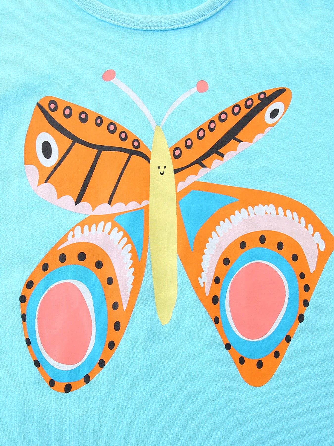 Light blue cotton t-shirt with a colorful butterfly graphic and smiling face.