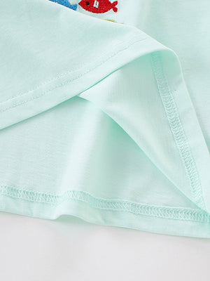 Light blue cotton crew neck t-shirt with embroidered fish detail.