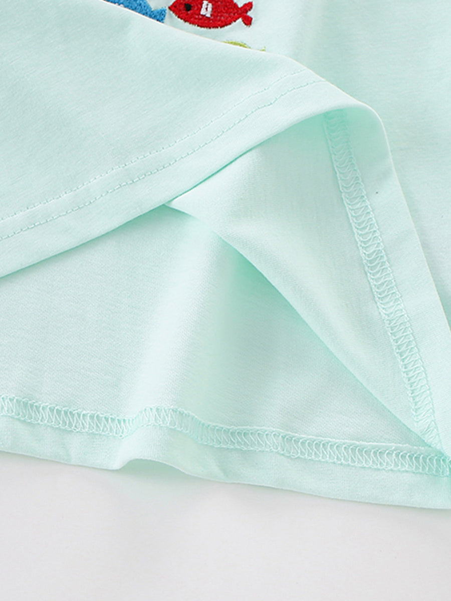 Light blue cotton crew neck t-shirt with embroidered fish detail.