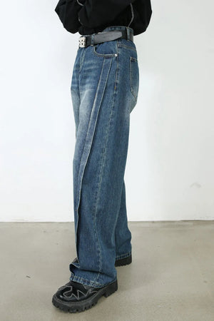 Medium wash denim jeans with wide legs and a prominent vertical seam detail.
