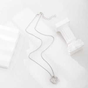 Silver clover pendant necklace with clear stones on a delicate chain