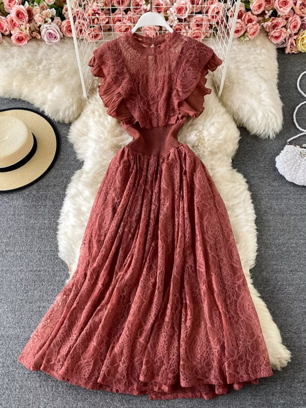 Elegant ruffled lace maxi dress in red with cutout details and a high neckline.