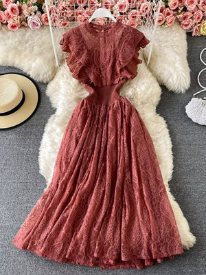 Elegant ruffled lace maxi dress in red with cutout details and a high neckline.