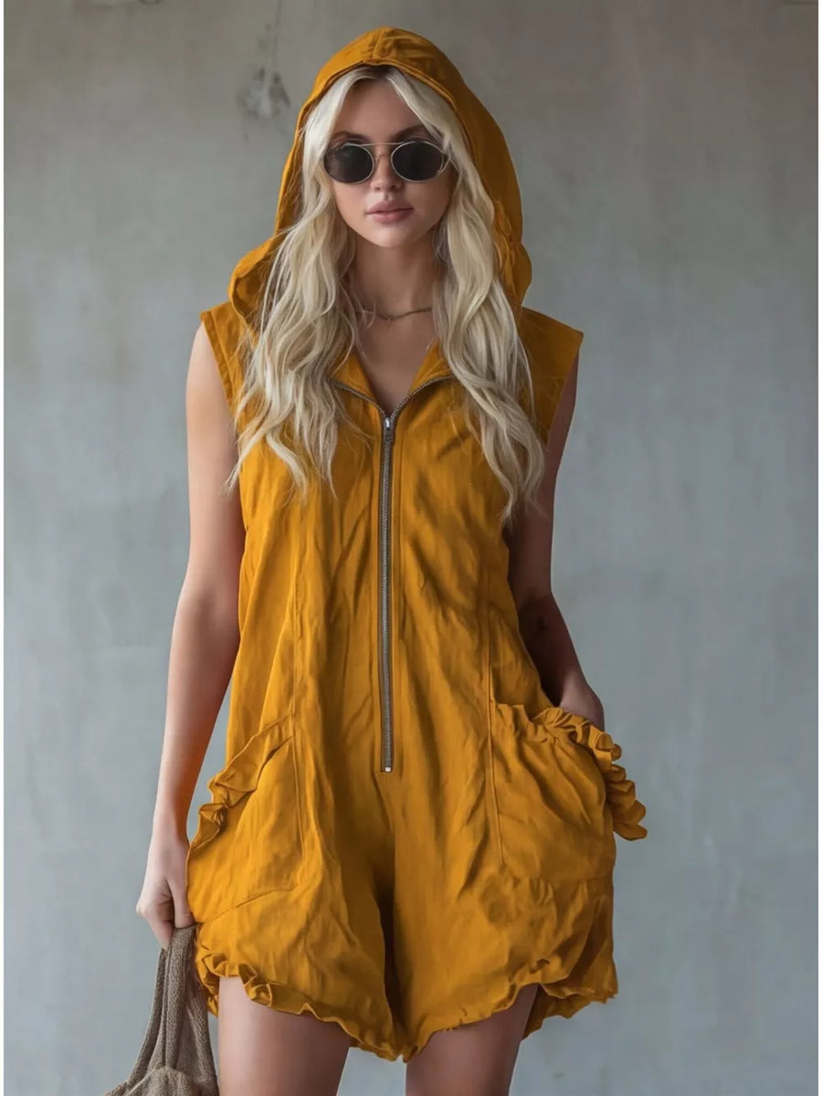 Yellow hooded sleeveless romper with ruffled pockets and zipper front.