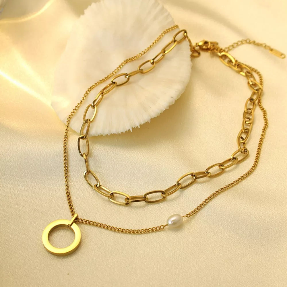 Synthetic Pearl,18K Gold-Plated,Stainless Steel Care instructions: Avoid wearing necklace in Gold with layered silhouette