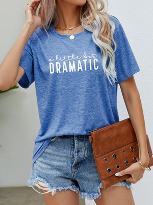 Cobalt blue crew neck tee with white "a little bit DRAMATIC" graphic text.