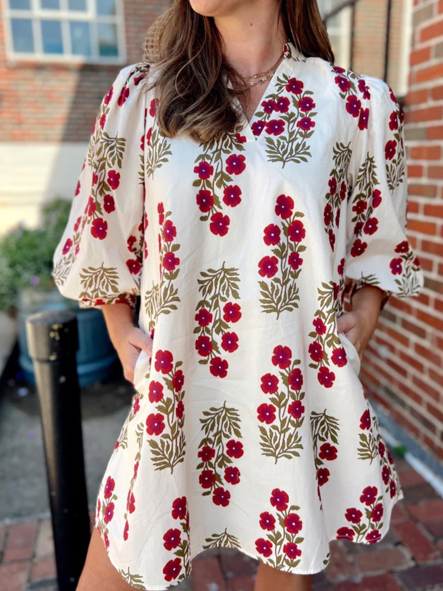 V-neck mini dress with pockets in cream cotton with red floral print and puff sleeves