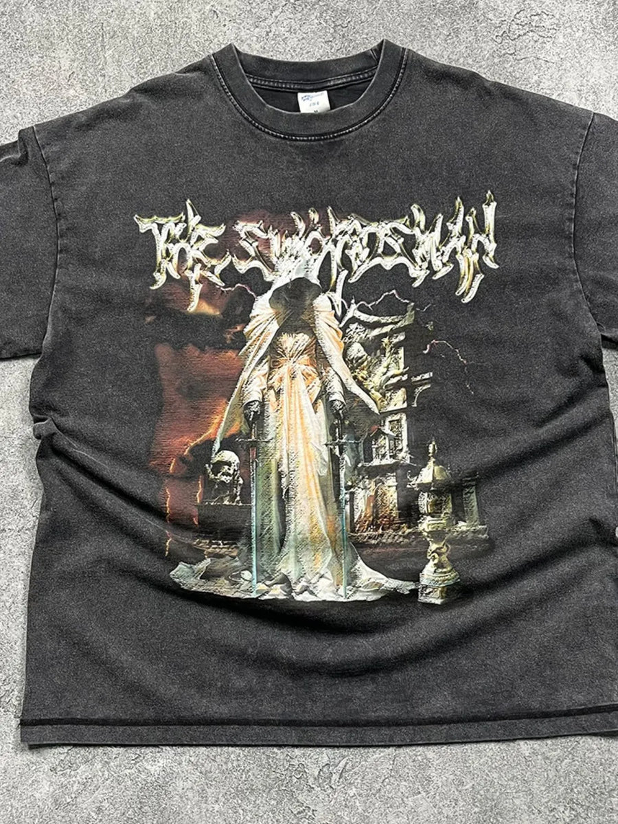 Vintage wash black graphic tee with a hooded figure and gothic imagery.