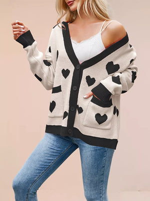 Pink cardigan with button-front and heart-print