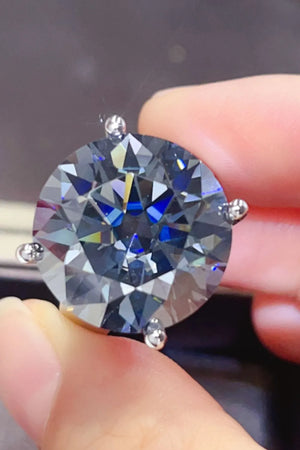 Round moissanite cocktail ring in royal blue with prong setting.