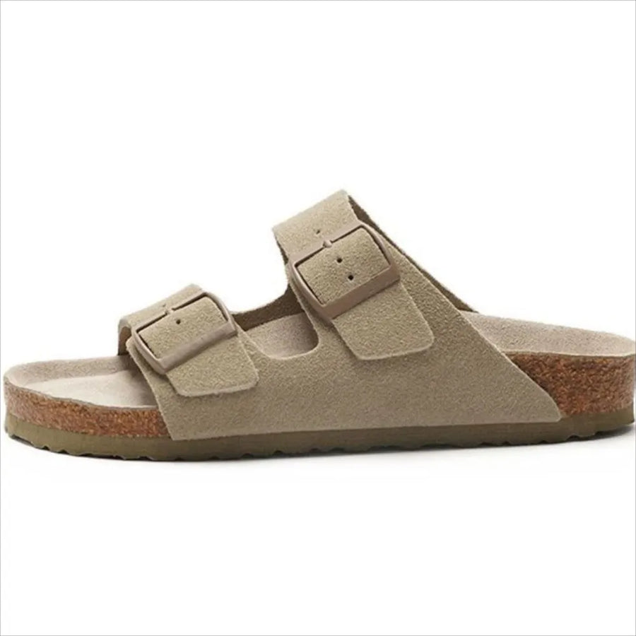 Suede slide sandals in beige with adjustable double buckle straps and cork sole.