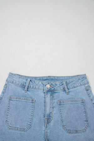 Light wash denim shorts with high rise and patch pockets.