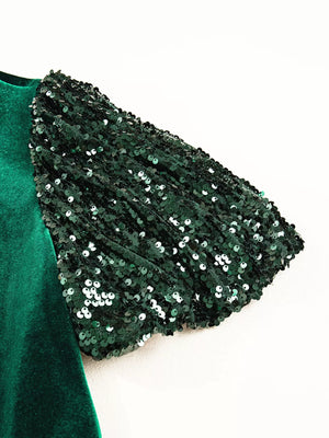 Dark green velvet mini dress with sequin puff sleeves.