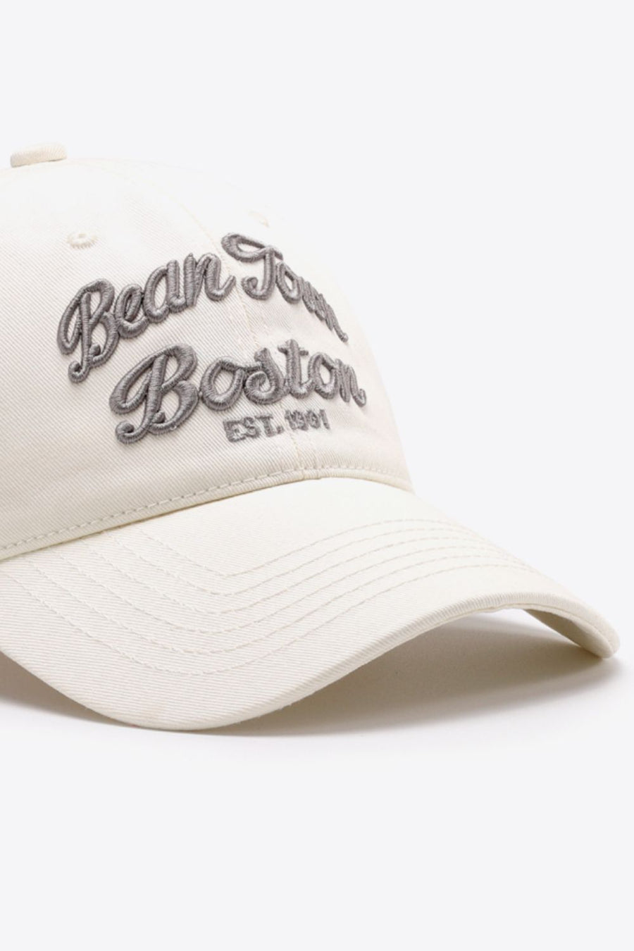 Ivory baseball cap with embroidered "Bean Town Boston Est. 1991" text.