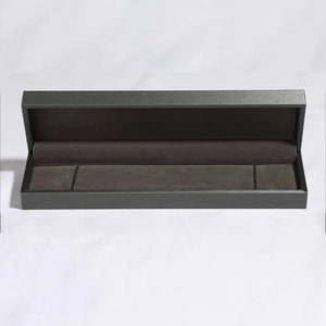 Open gray jewelry box with dark gray velvet lining