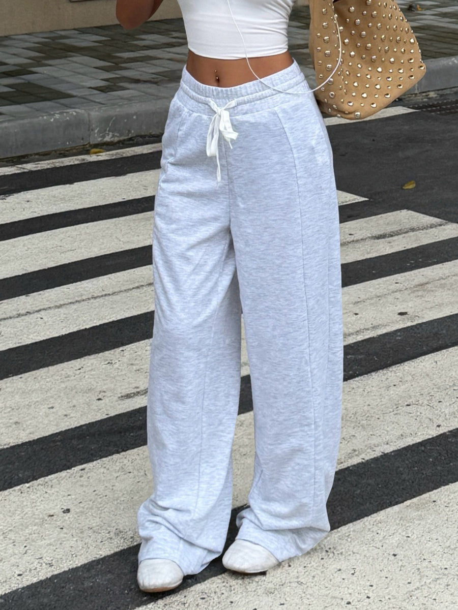 95% polyester, 5% elastane Care instructions: Machine wash cold wide-leg pants in heather gray with loose silhouette