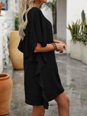 Black V-neck mini dress with flowy ruffle sleeves and hem.