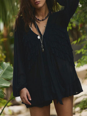 Black sheer ruffle trim beach cover-up with long sleeves and a V-neckline.