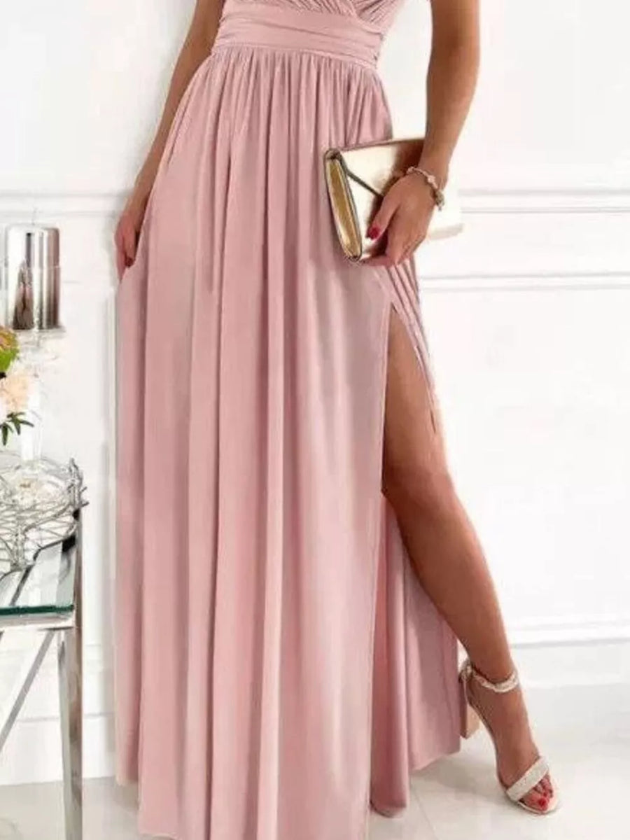 Dusty pink maxi dress with high slit and lace accents, featuring a ruched bodice.