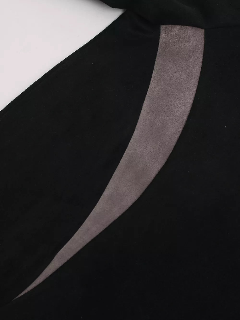 Black athletic t-shirt with a grey suede stripe detail.