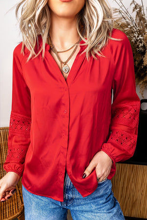 blouse in red featuring buttoned and relaxed fit