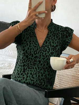 Green leopard print blouse with ruffled cap sleeves and a V-neck.