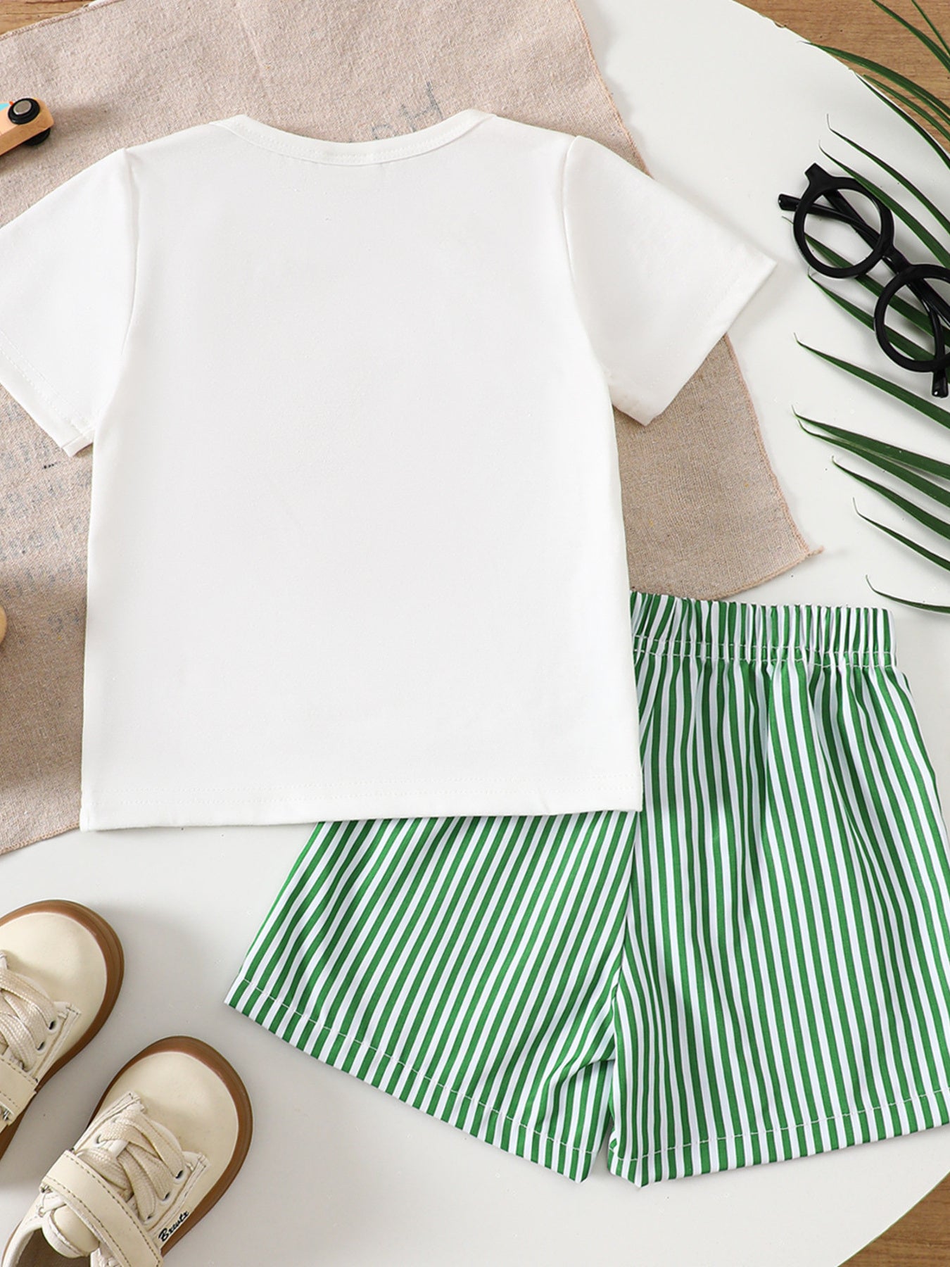 White baby tee with green striped shorts, cotton crew neck outfit