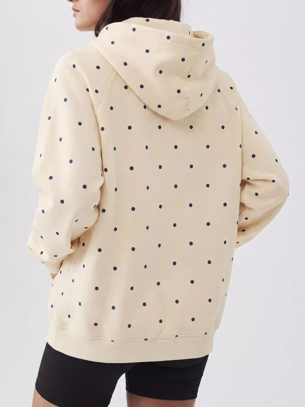 navy blue pullover hoodie featuring pocketed and polka dot