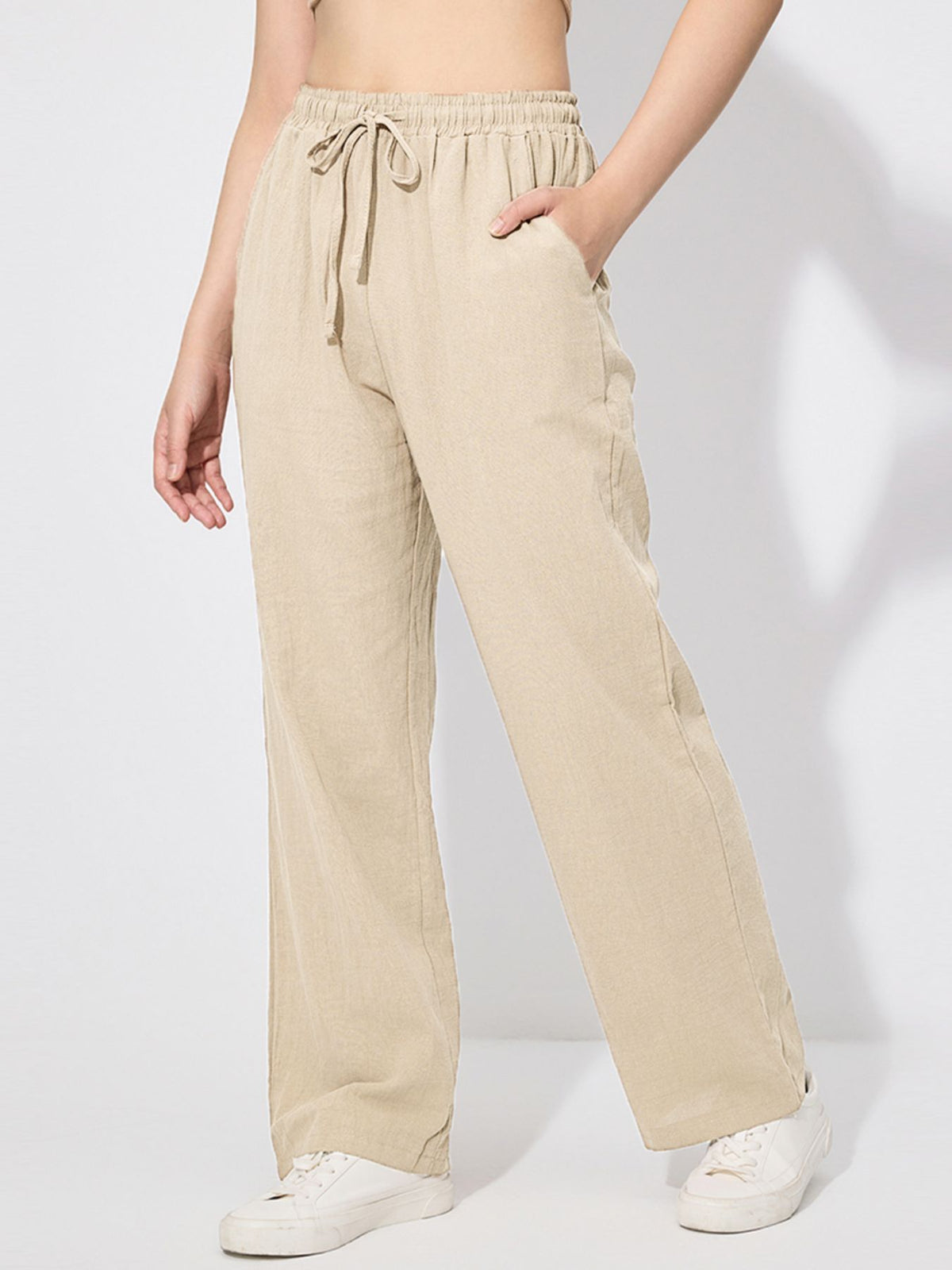 Drawstring wide leg casual pants in apricot with pockets and a relaxed fit.