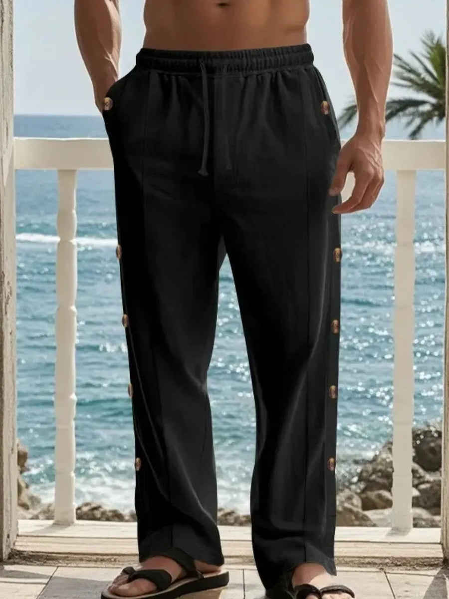 Black linen palazzo trousers with side buttons and drawstring waist.