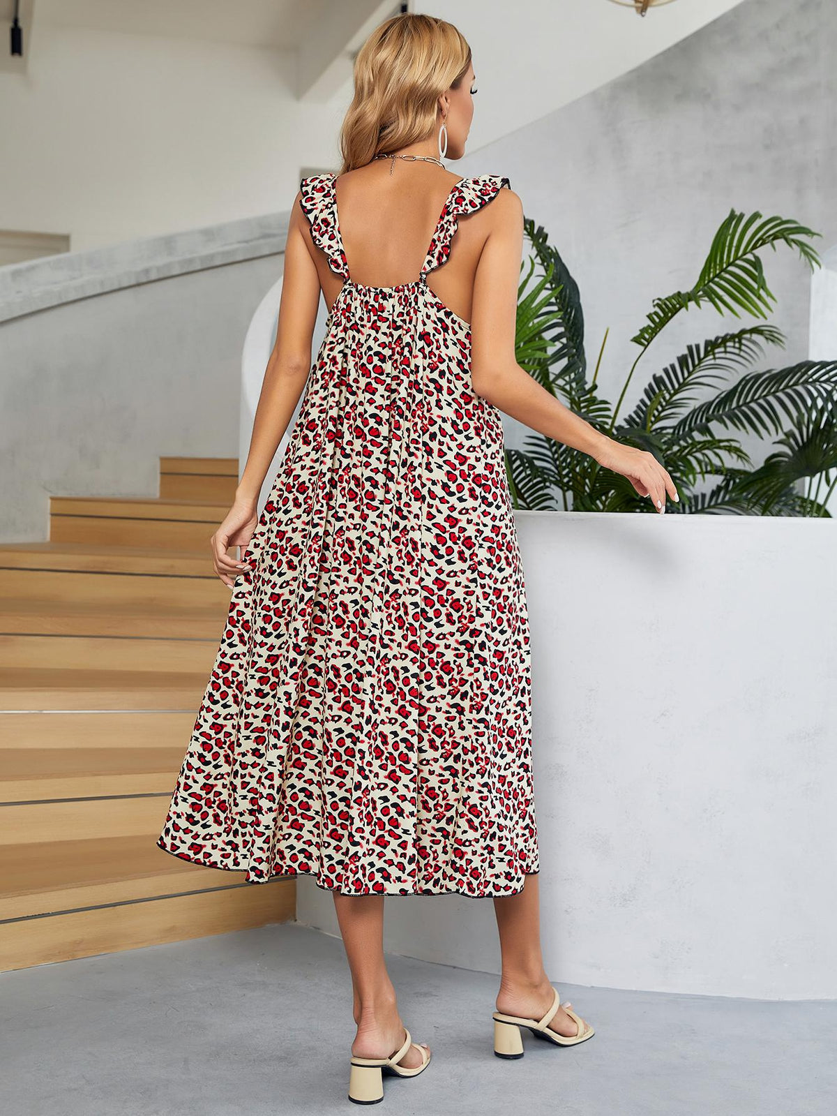 Leopard print midi dress in deep red with ruffle straps and a cinched waist.