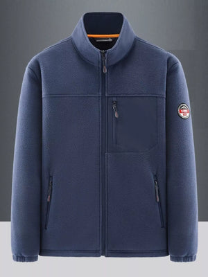 Men's dark blue fleece sport jacket with stand collar, zip front, and chest pocket.