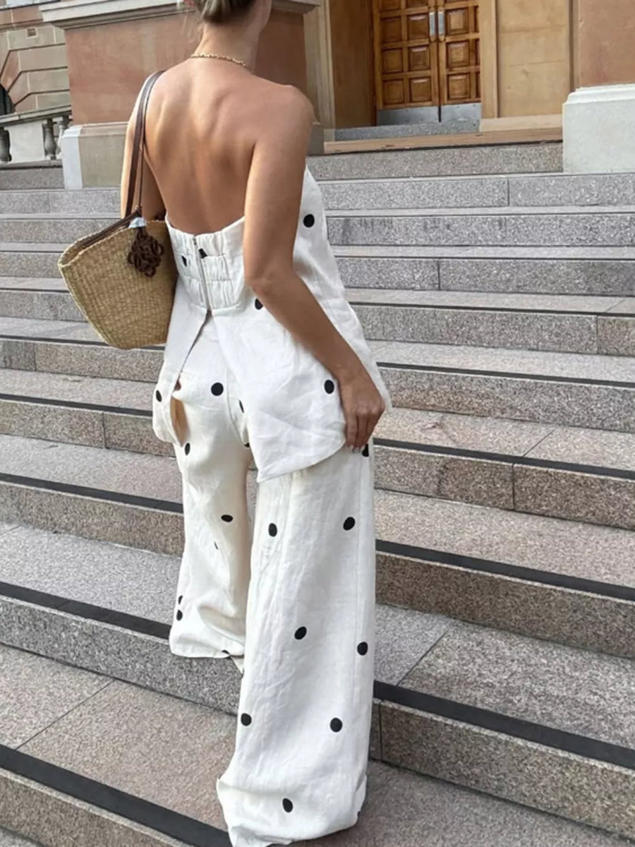 White linen polka dot jumpsuit with wide legs and a strapless bodice