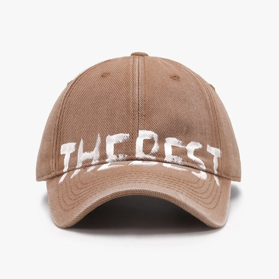 Textured denim baseball cap in coffee brown with white graphic text detail.