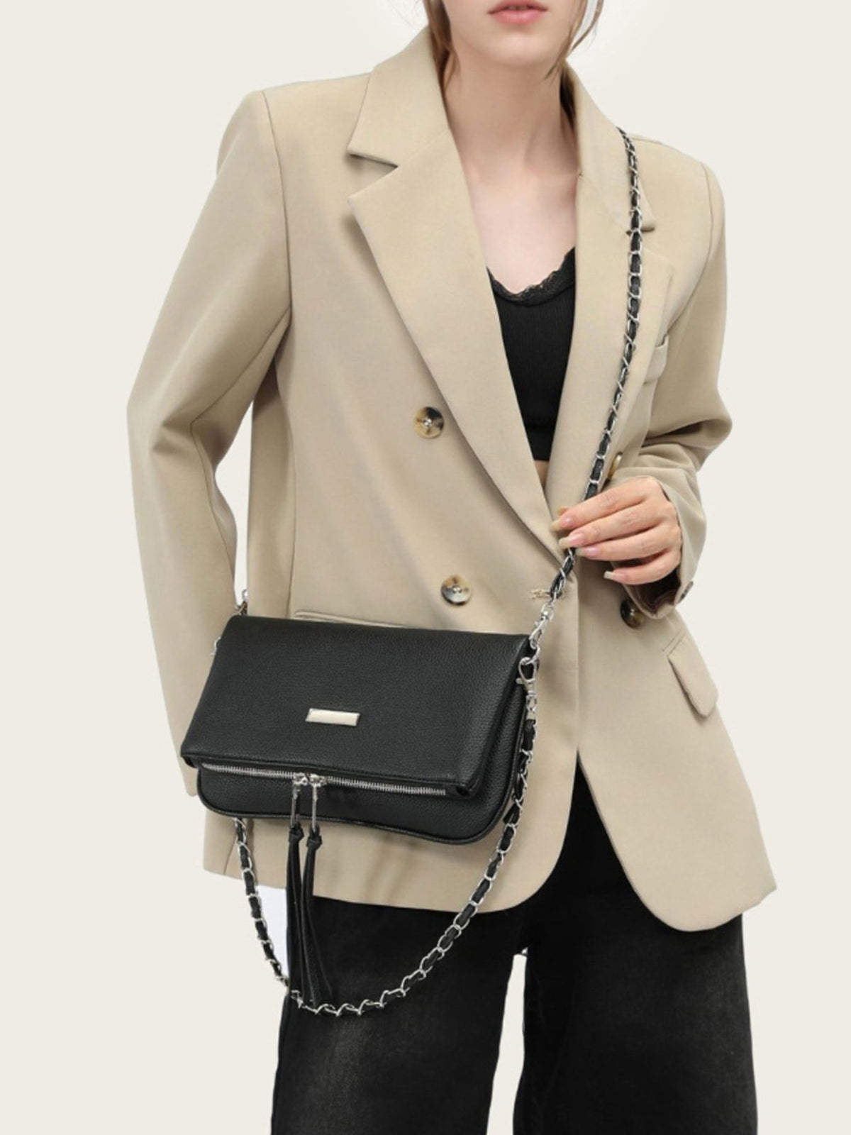 shoulder bag in black featuring chain strap and rectangular fit