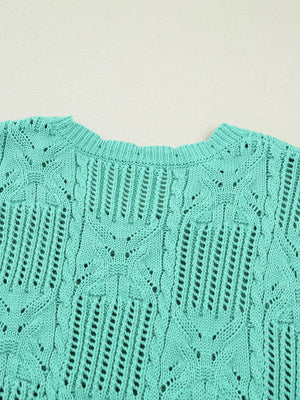 Teal pointelle knit sweater with scalloped trim and openwork pattern.