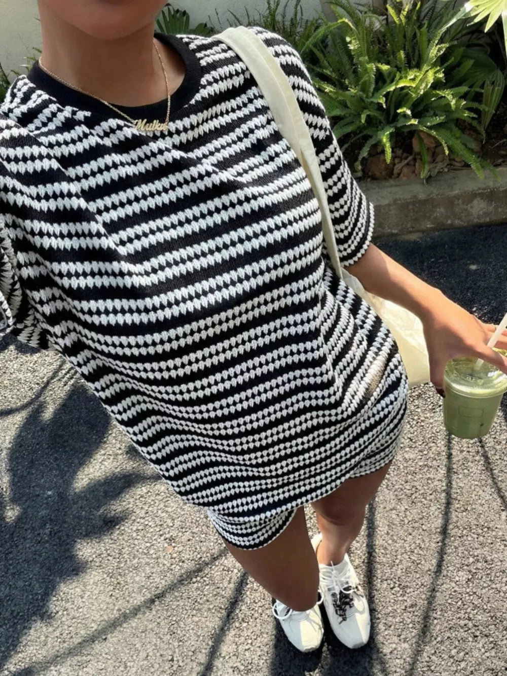 Striped relaxed fit two-piece set in black stripes with short sleeves and a crew neck.