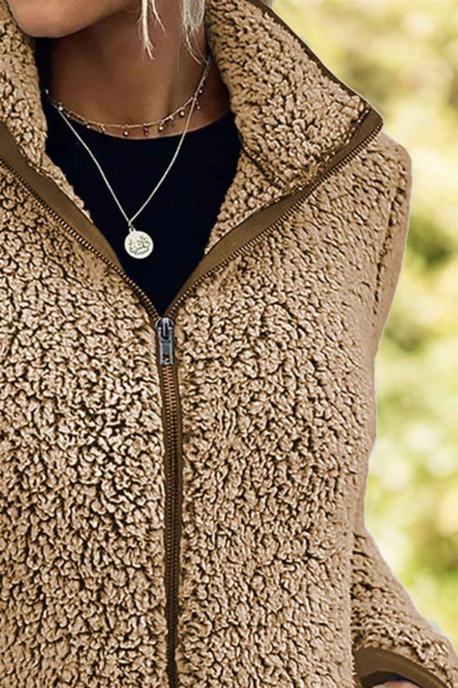 Camel teddy fleece zip-up jacket with a stand-up collar and full zipper.
