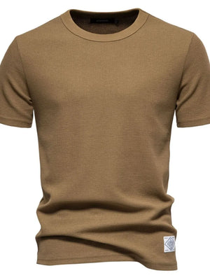 Textured crew-neck t-shirt in Caramel waffle knit with short sleeves and a small logo patch.