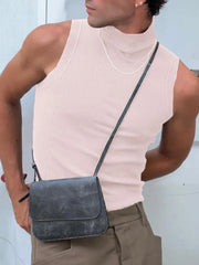 Sleeveless ribbed turtleneck shirt in blush pink, with a high neck.