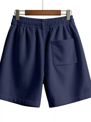 Navy blue corduroy chino shorts with elastic drawstring waist and back pocket.
