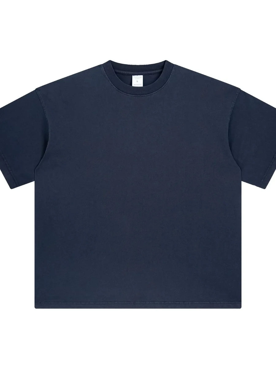 Oversized washed cotton crewneck t-shirt in navy blue with crew neckline and short sleeves.