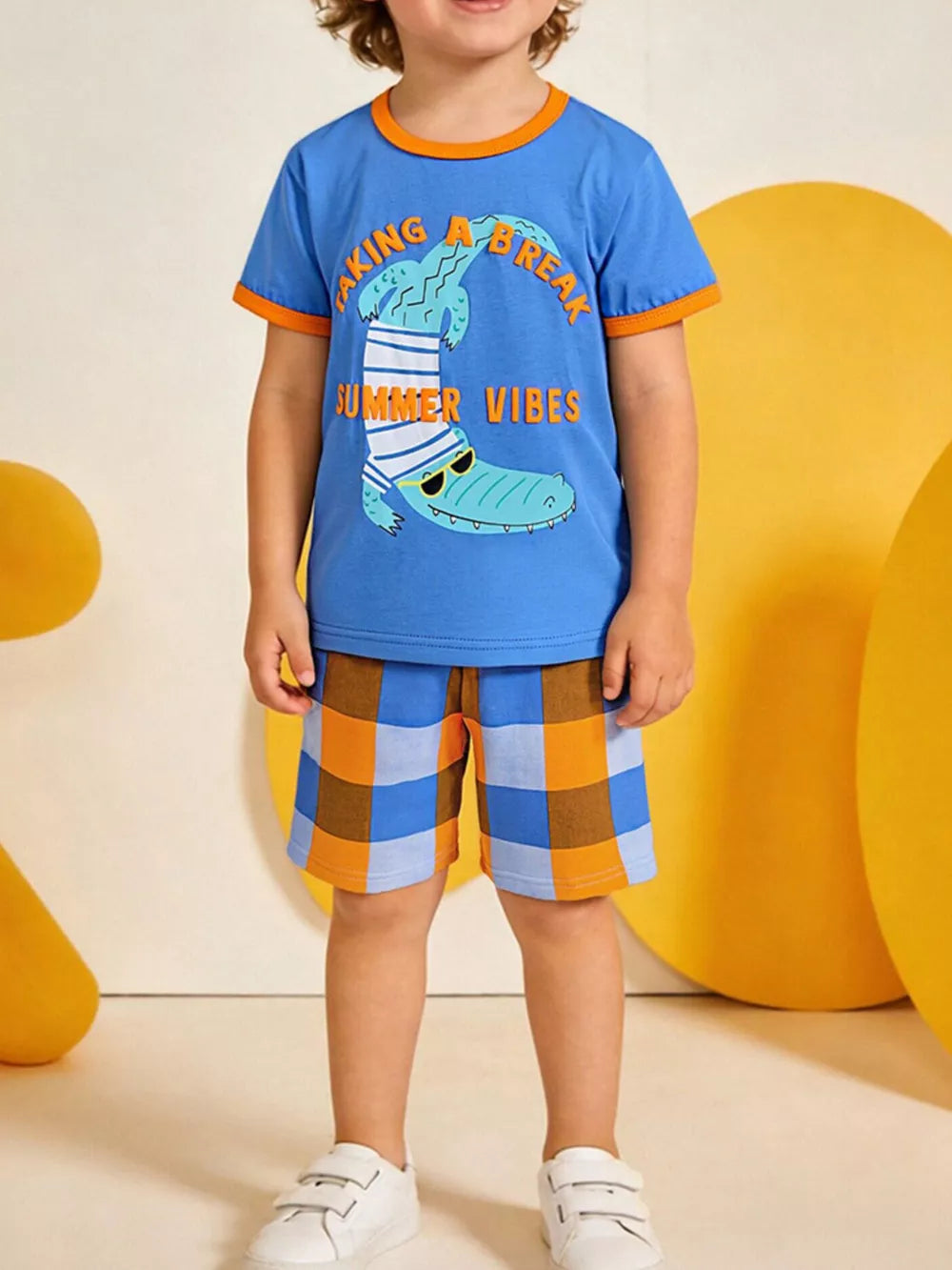 Blue cotton graphic tee with orange trim and checkered shorts set for baby boys.