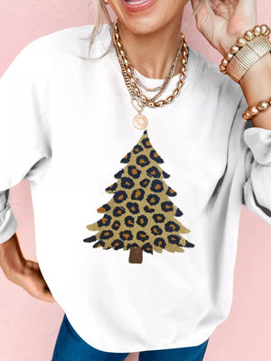 White drop shoulder sweatshirt with a leopard print Christmas tree graphic.