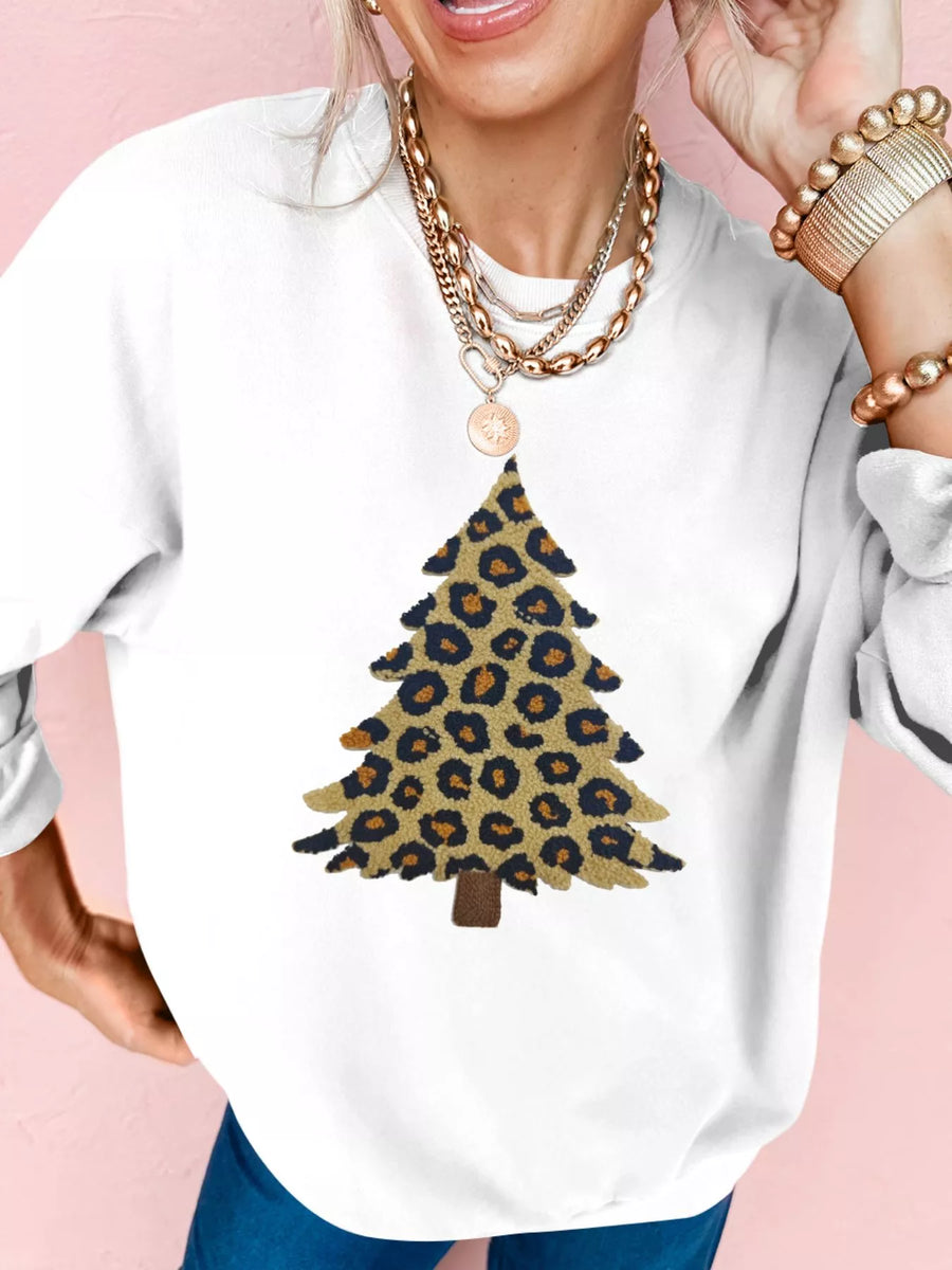 White drop shoulder sweatshirt with a leopard print Christmas tree graphic.