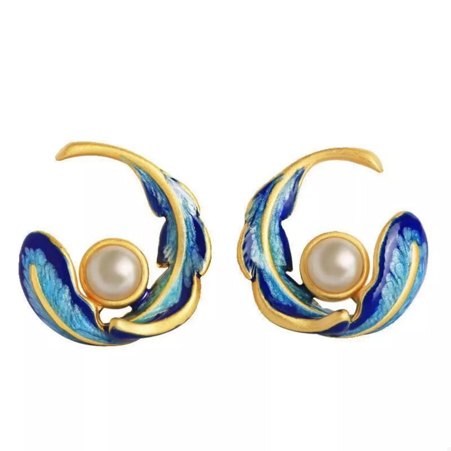 Elegant blue feather earrings with pearl detail and gold accents
