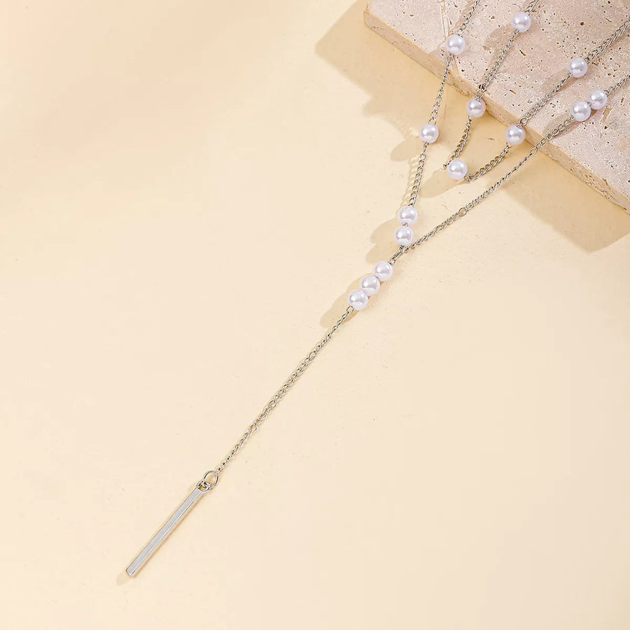Silver double layered Y-shaped necklace with pearls and bar pendant